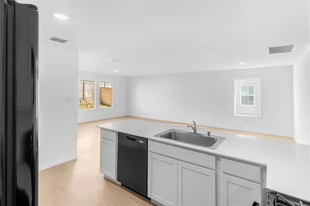 a kitchen with a sink and a window