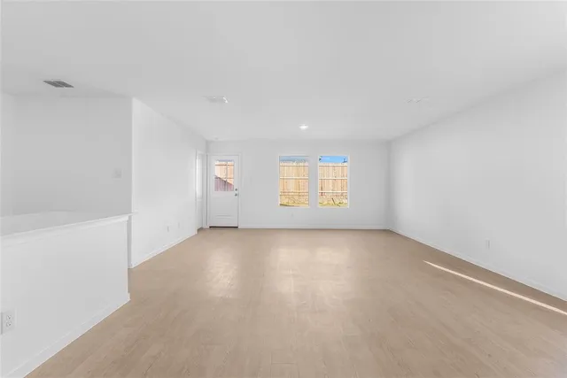 an empty room with windows