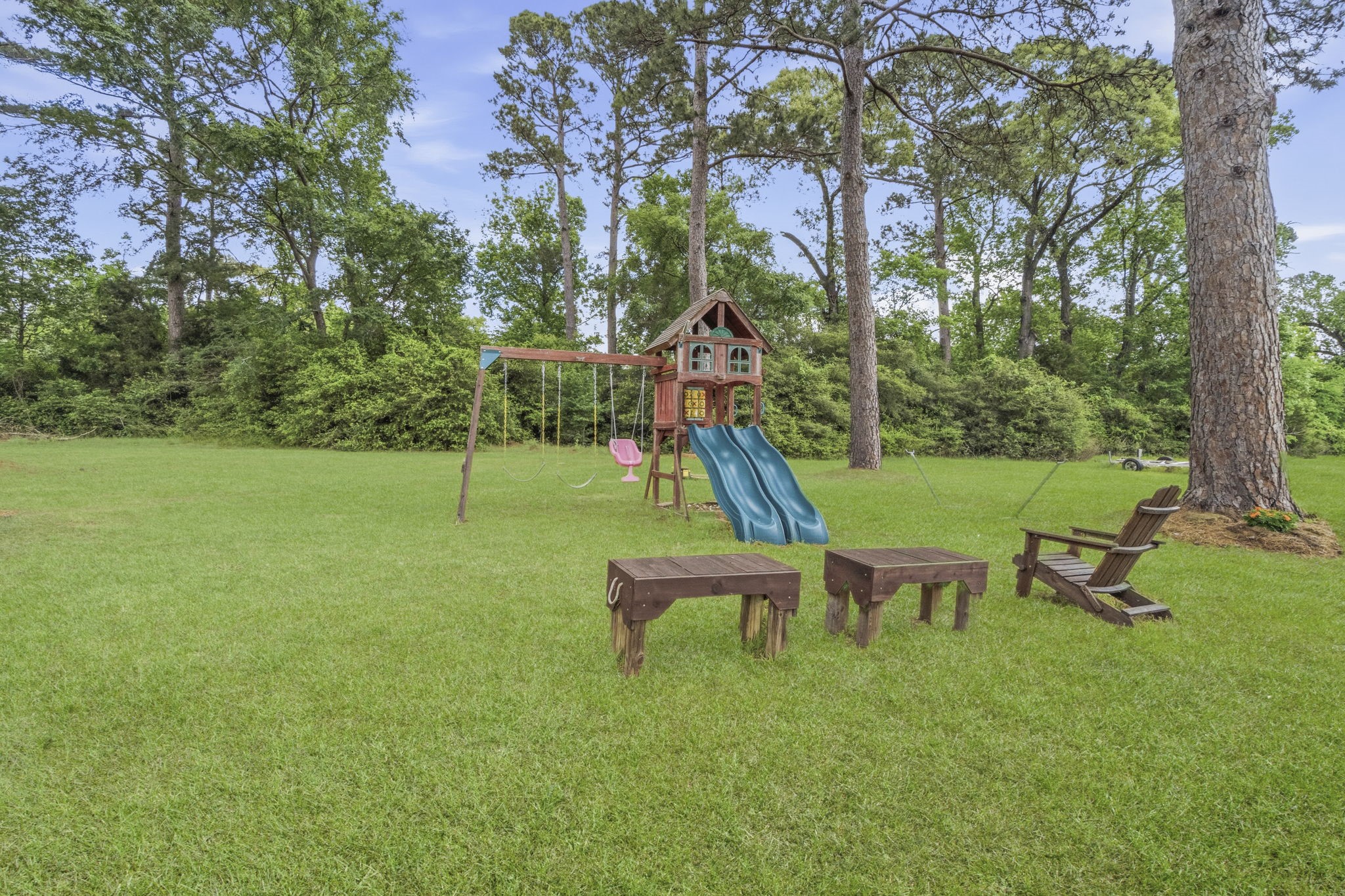 259 Memphis Bell Lane Trinity, TX 75862 - Photo 48 of 50 a backyard of a house with table and chairs