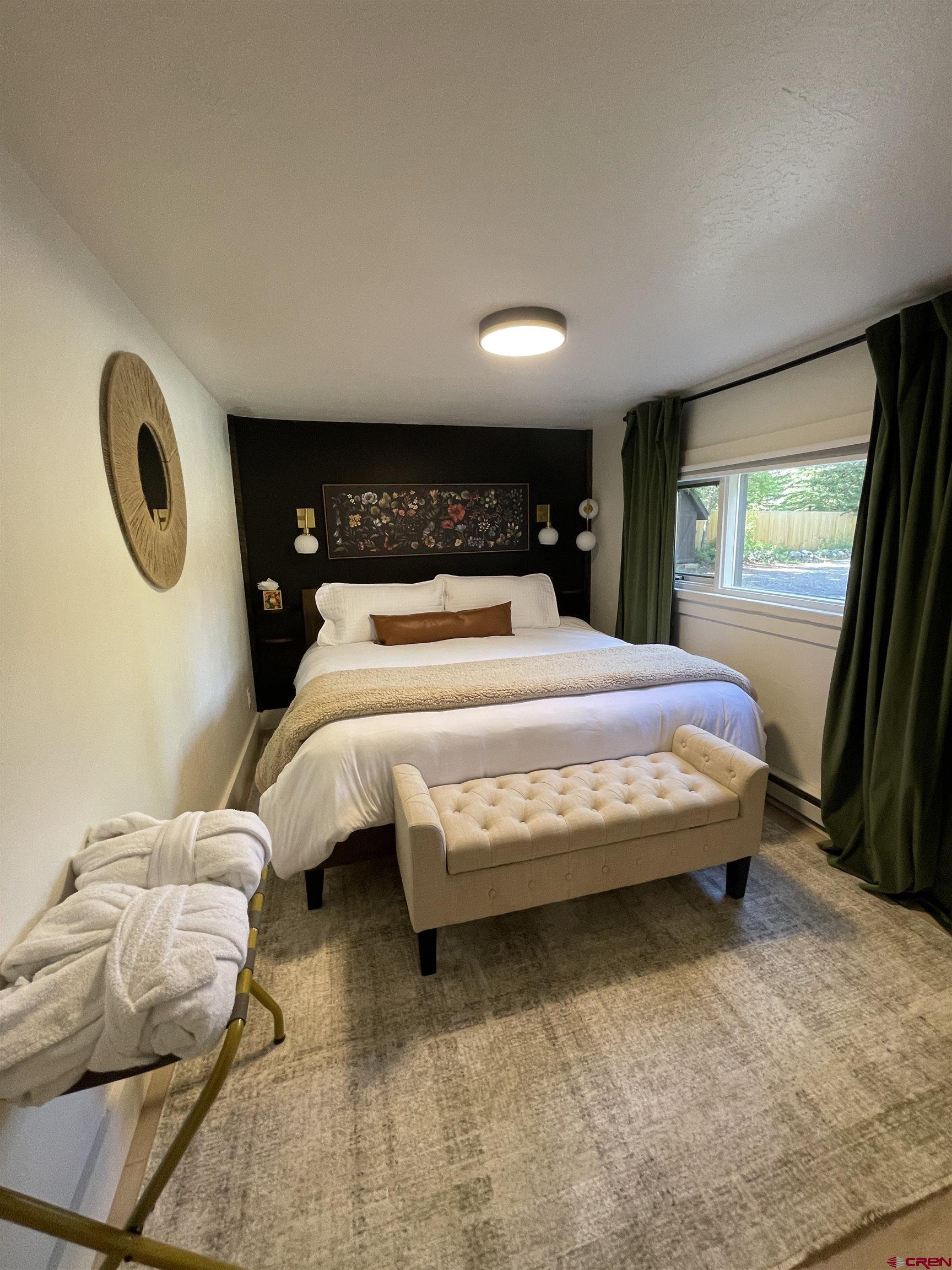 170 Lower Allen Road Crested Butte, CO 81224 - Photo 22 of 42 a bedroom with a bed and window