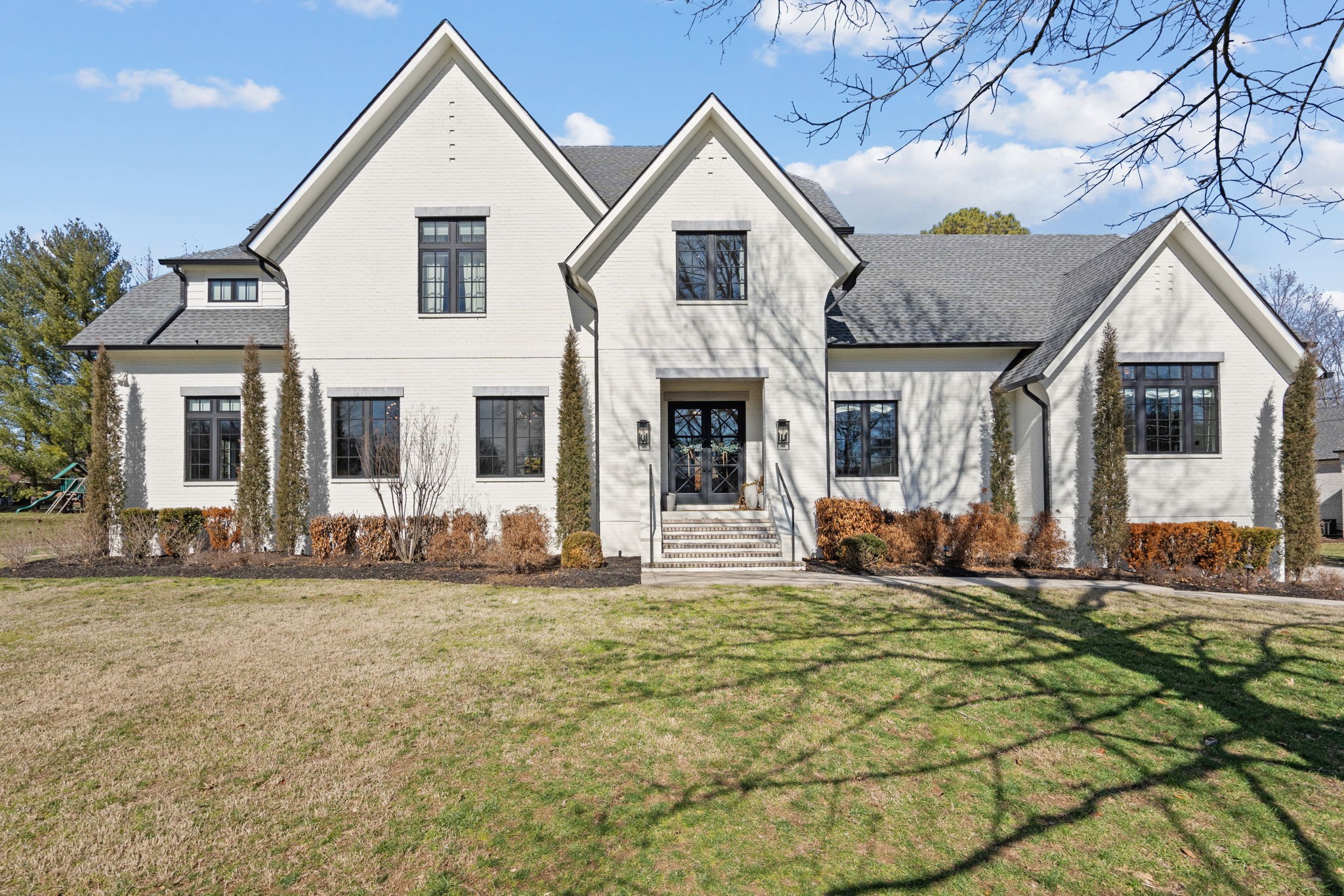 a front view of a house with a yard