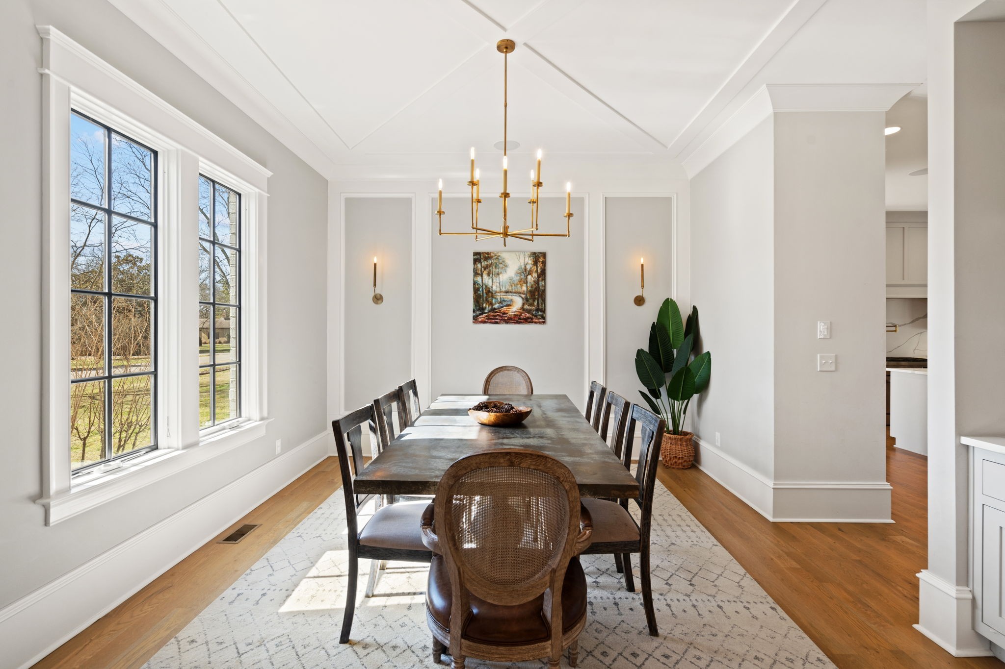 5108 Seward Road Brentwood, TN 37027 - Photo 8 of 66 a dining room with furniture potted plants and wooden floor