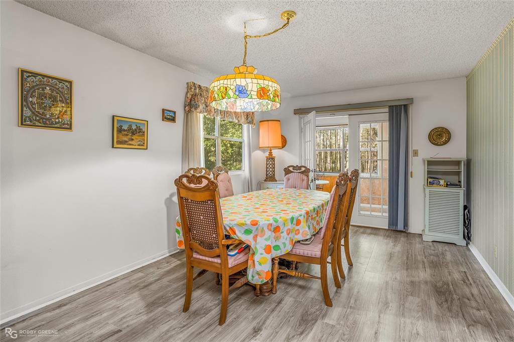 251 Tom Murphy Road Jamestown, LA 71045 - Photo 19 of 40 Dining space featuring a textured ceiling and light wood-type flooring
