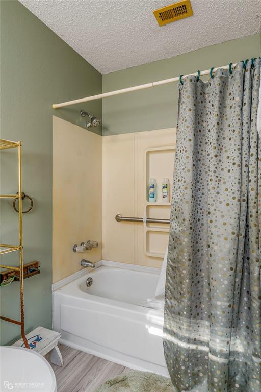 251 Tom Murphy Road Jamestown, LA 71045 - Photo 30 of 40 Full bath with shower / tub combo and a textured ceiling