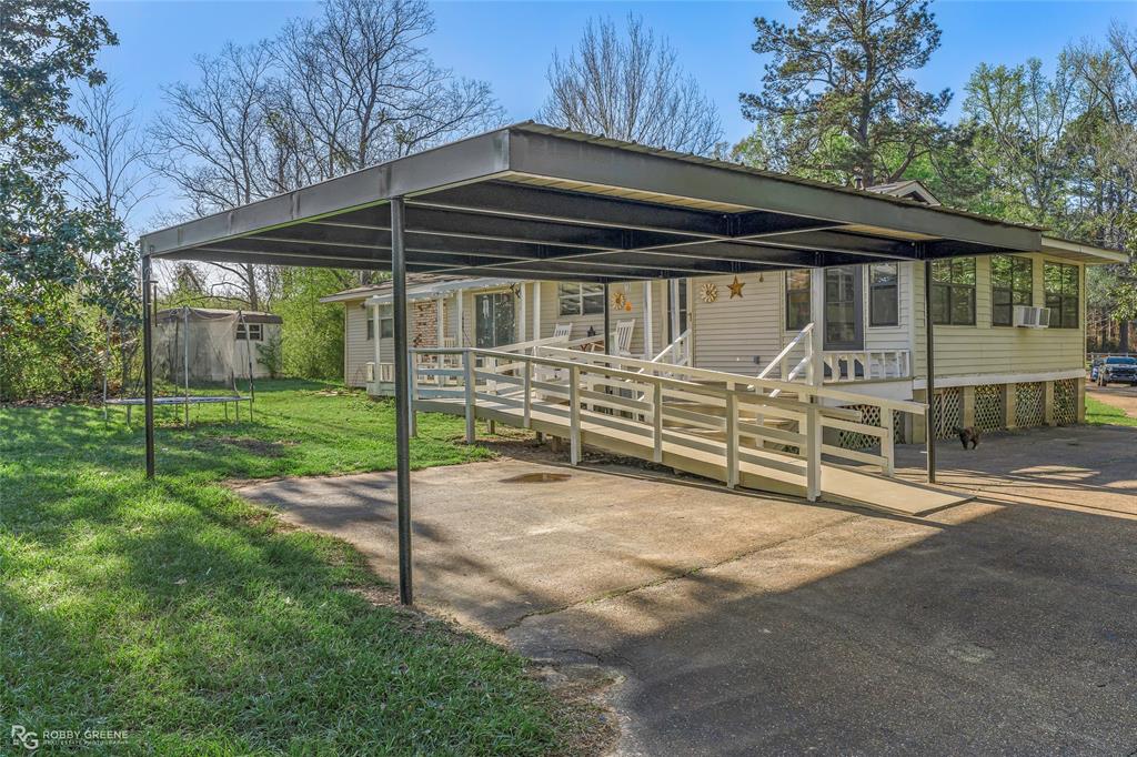 251 Tom Murphy Road Jamestown, LA 71045 - Photo 7 of 40 View of front of house featuring a front yard, a carport, and a patio