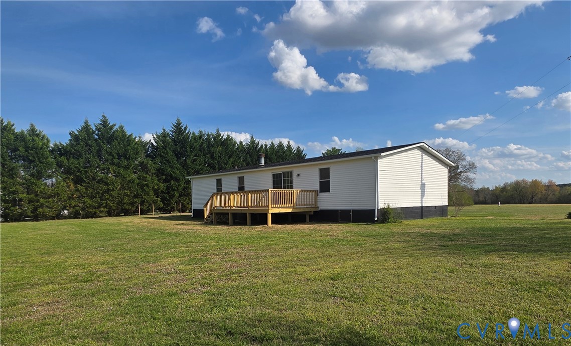 16808 Hamilton Arms Road Dewitt, VA 23840 - Photo 2 of 30 a view of a house with a big yard