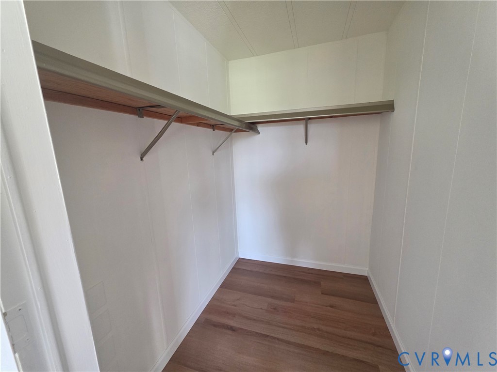 16808 Hamilton Arms Road Dewitt, VA 23840 - Photo 24 of 30 a view of walk in closet with wooden floor
