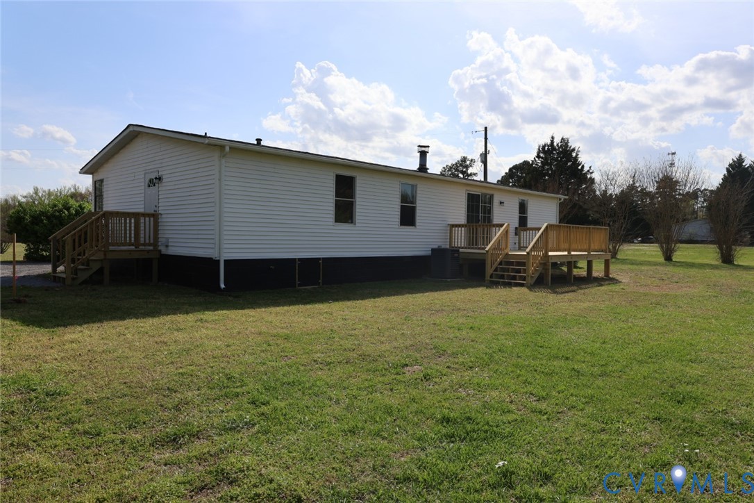 16808 Hamilton Arms Road Dewitt, VA 23840 - Photo 29 of 30 a backyard of a house with table and chairs