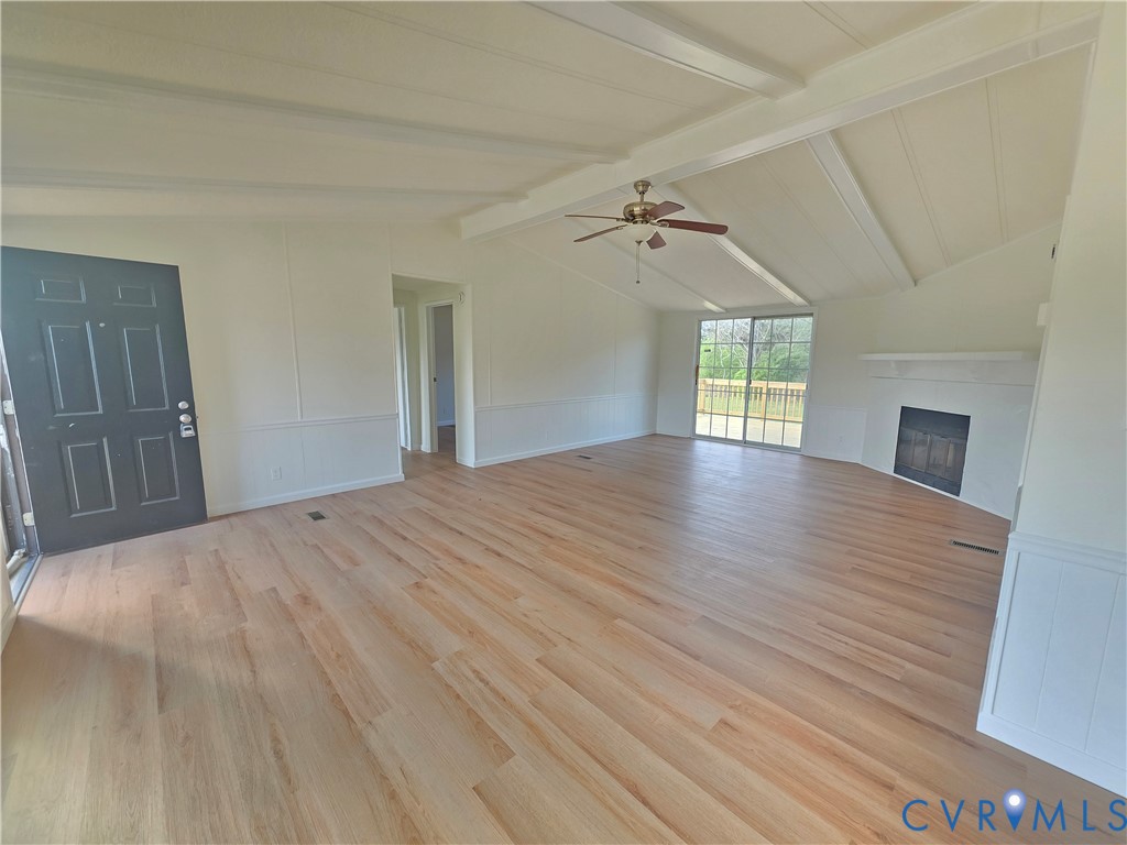 16808 Hamilton Arms Road Dewitt, VA 23840 - Photo 7 of 30 a view of empty room with wooden floor and fan