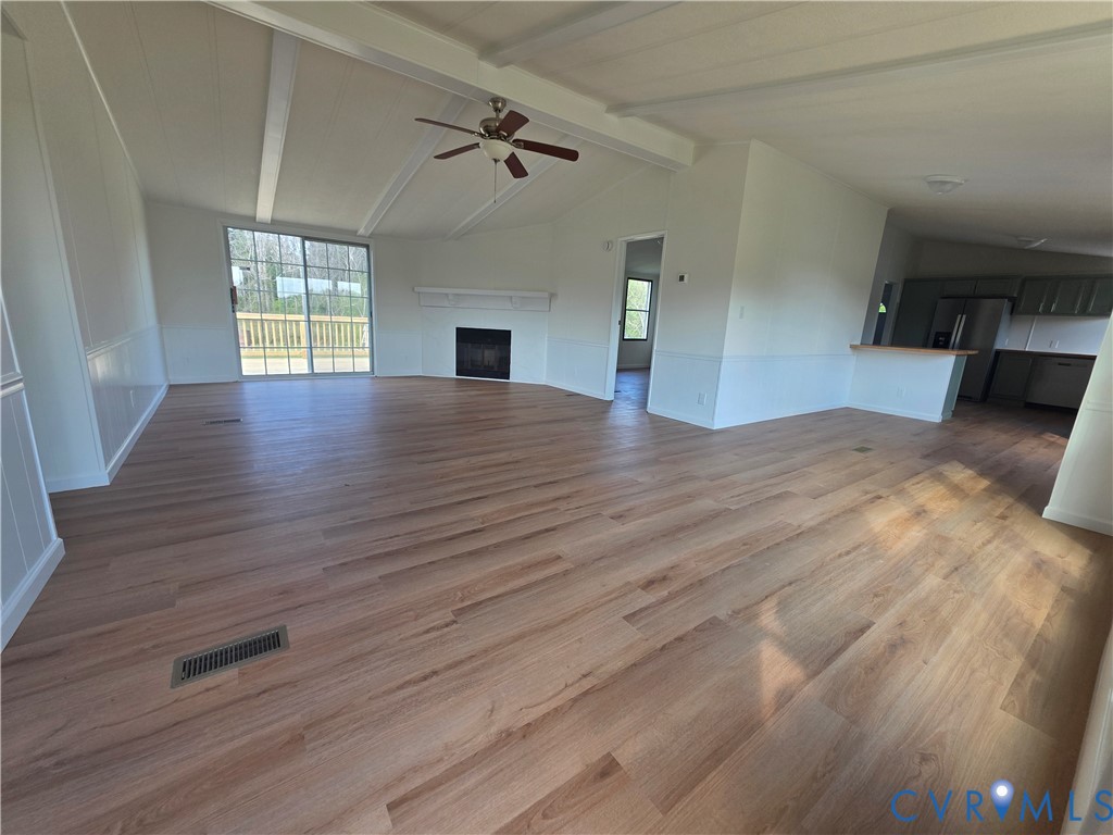 16808 Hamilton Arms Road Dewitt, VA 23840 - Photo 10 of 30 a view of empty room with wooden floor and fan