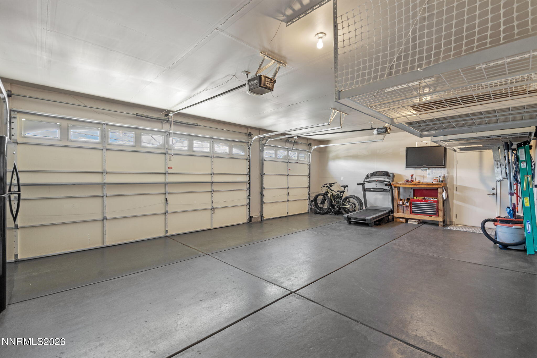 18324 Panda Bear Court Reno, NV 89508 - Photo 23 of 44 a view of a garage with parked cars