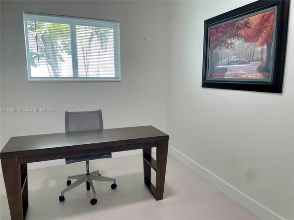 a view of a workspace with furniture