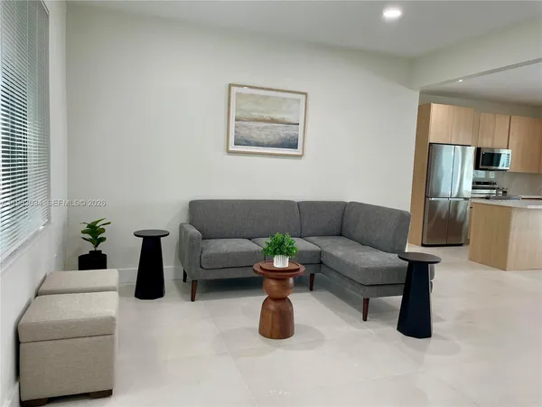 a living room with furniture and a couch