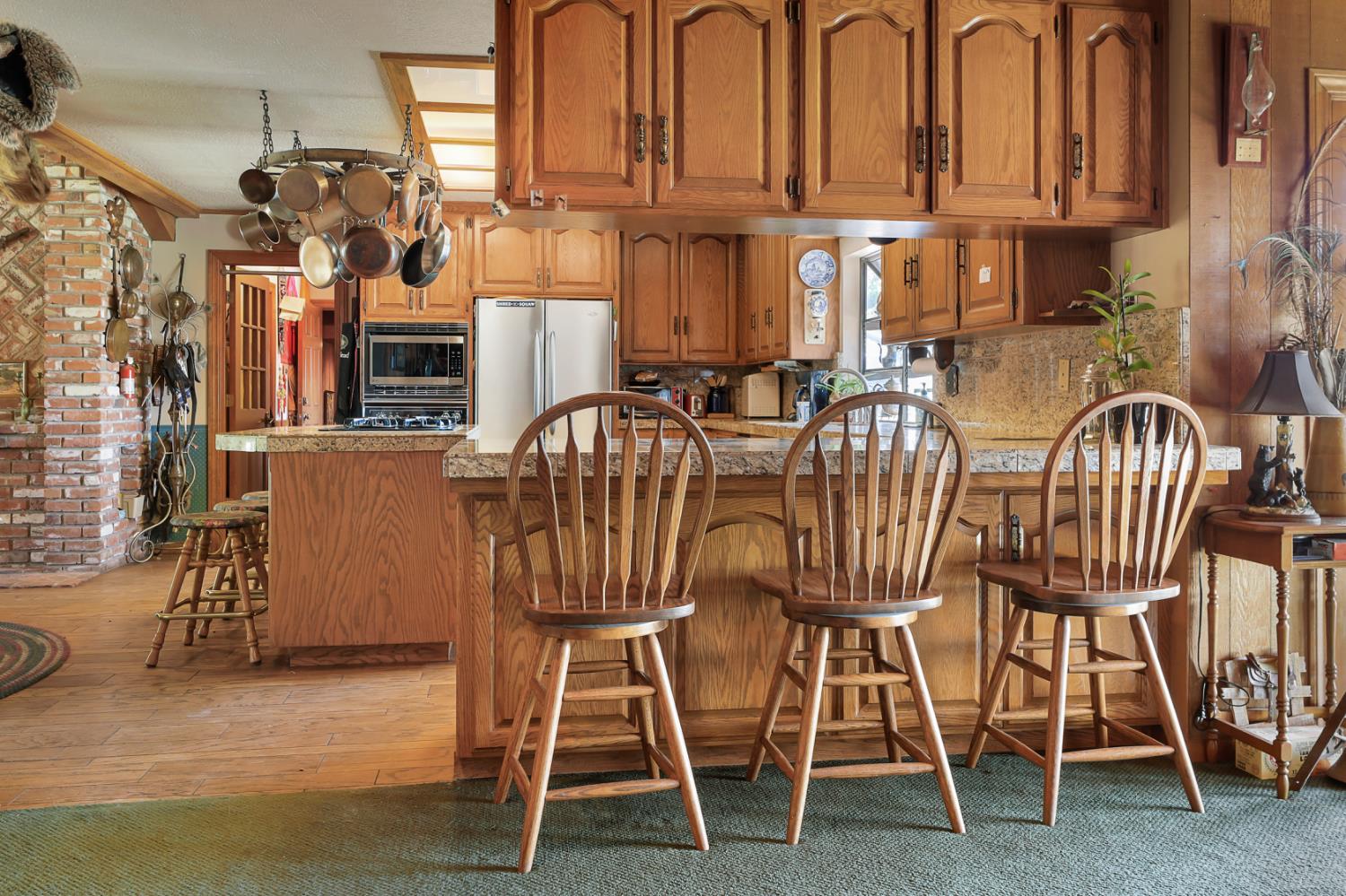 22050 Buena Vista Road Clements, CA 95227 - Photo 13 of 61 a view of a dining room with chairs