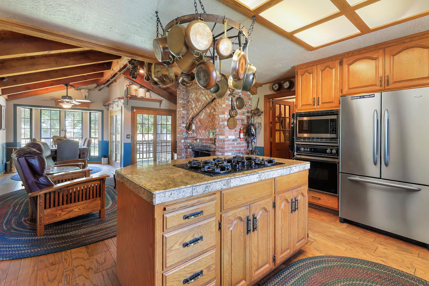 22050 Buena Vista Road Clements, CA 95227 - Photo 17 of 61 a kitchen that has a stove a sink and a refrigerator