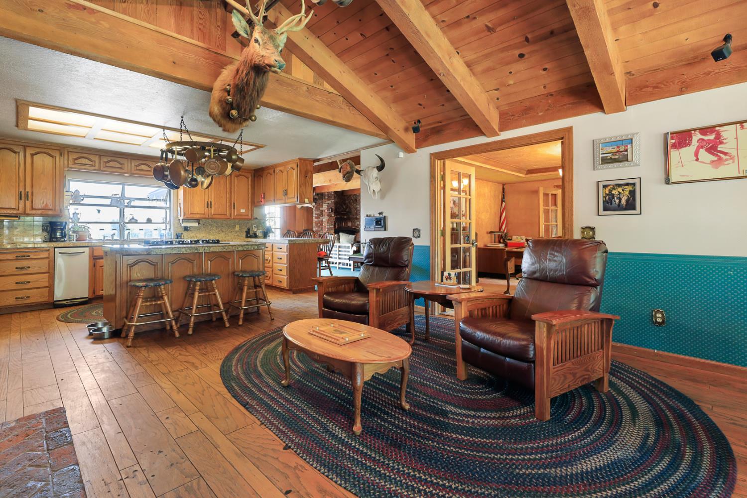 22050 Buena Vista Road Clements, CA 95227 - Photo 23 of 61 a living room with furniture and a chandelier