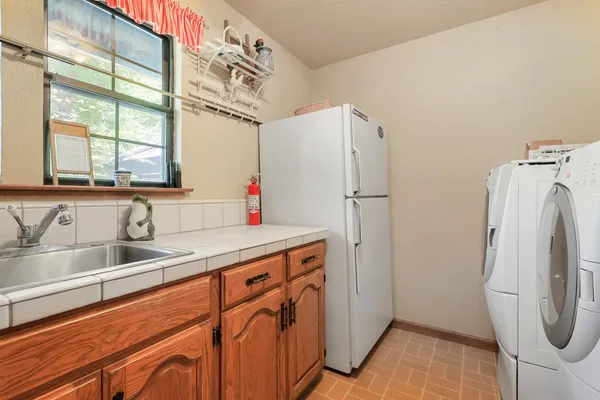 a bathroom with a sink a vanity and a shower
