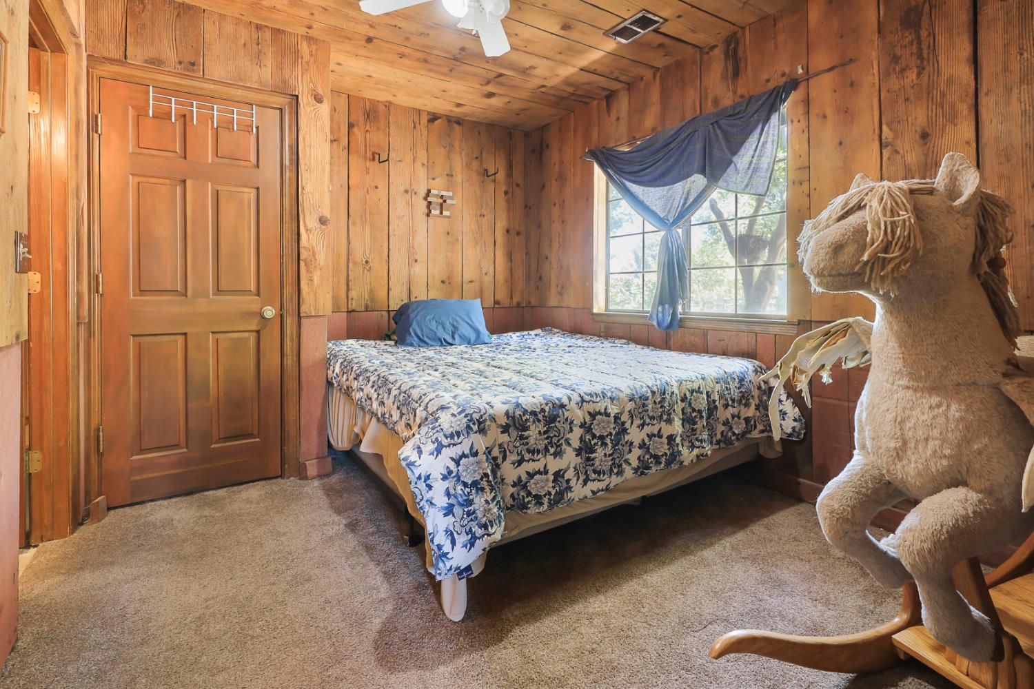 22050 Buena Vista Road Clements, CA 95227 - Photo 29 of 61 a bedroom with a bed and a window