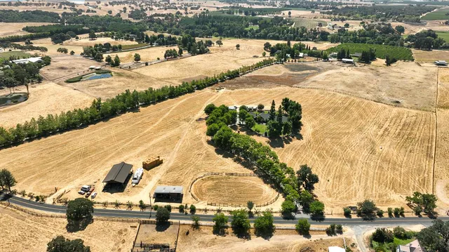 a view of yard with swimming pool and green space