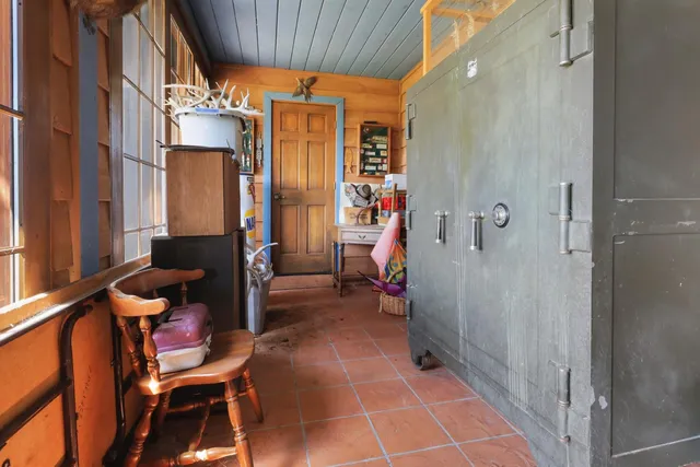 a bedroom with bed and window