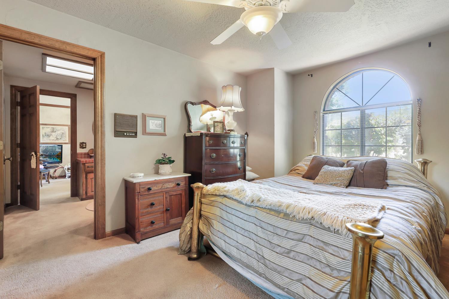 22050 Buena Vista Road Clements, CA 95227 - Photo 38 of 61 a bedroom with a bed and a large window