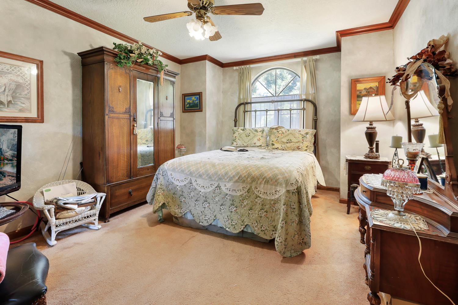 22050 Buena Vista Road Clements, CA 95227 - Photo 40 of 61 a bedroom with a bed and a chandelier