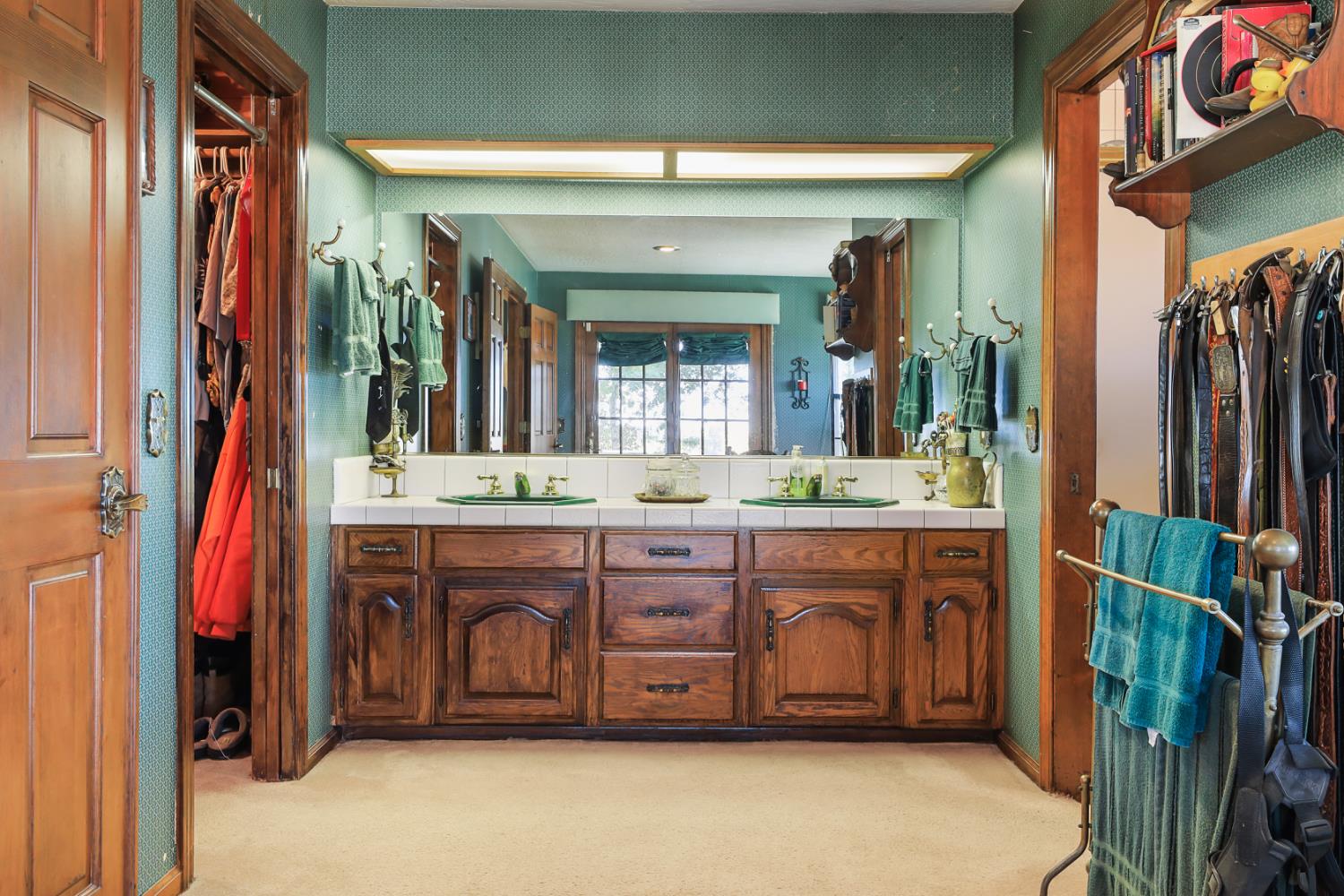 22050 Buena Vista Road Clements, CA 95227 - Photo 46 of 61 a bathroom with a double vanity sink and a mirror