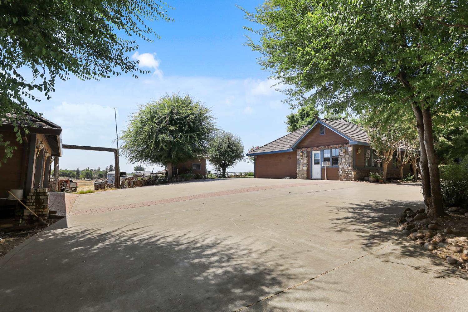 22050 Buena Vista Road Clements, CA 95227 - Photo 50 of 61 a front view of a house with a yard and garage