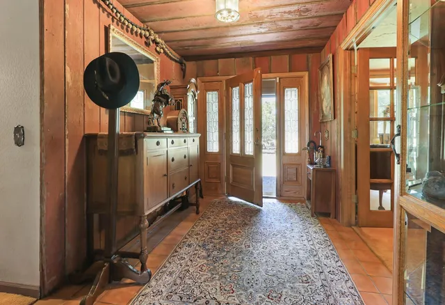 a view of a livingroom with furniture and a window