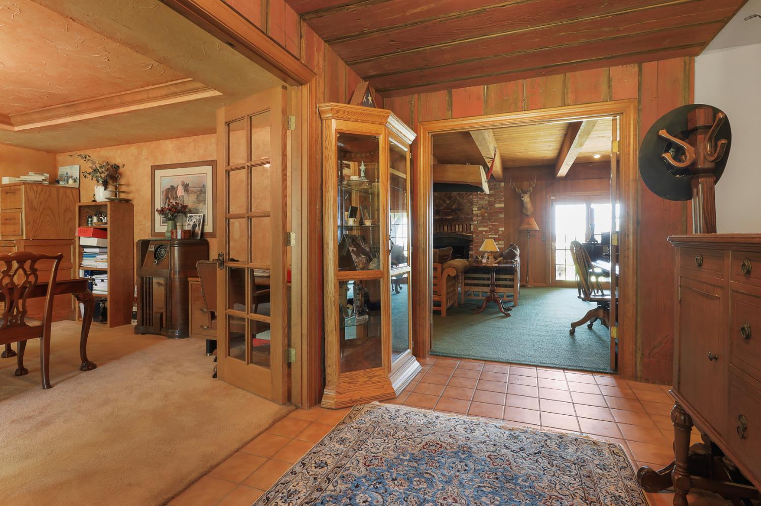 22050 Buena Vista Road Clements, CA 95227 - Photo 7 of 61 a view of a hallway with wooden floor and a living room
