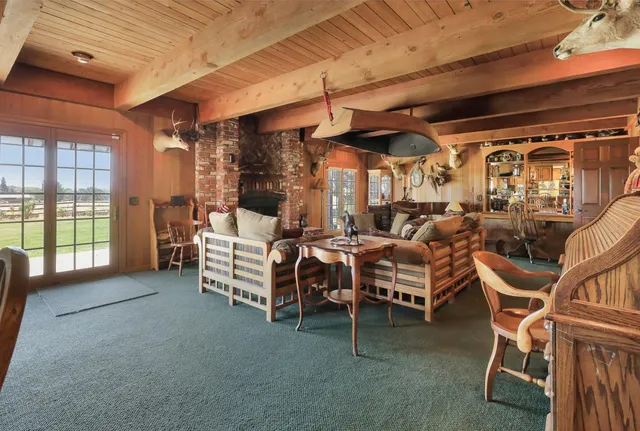 a view of a chair and table in a room
