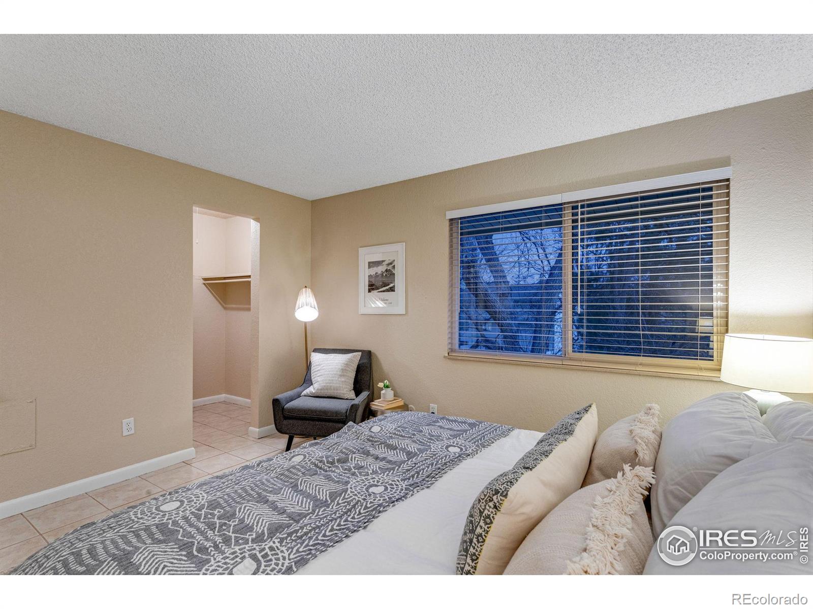 1705 Heatheridge Road Fort Collins, CO 80526 - Photo 18 of 21 a bedroom with a bed next to a window