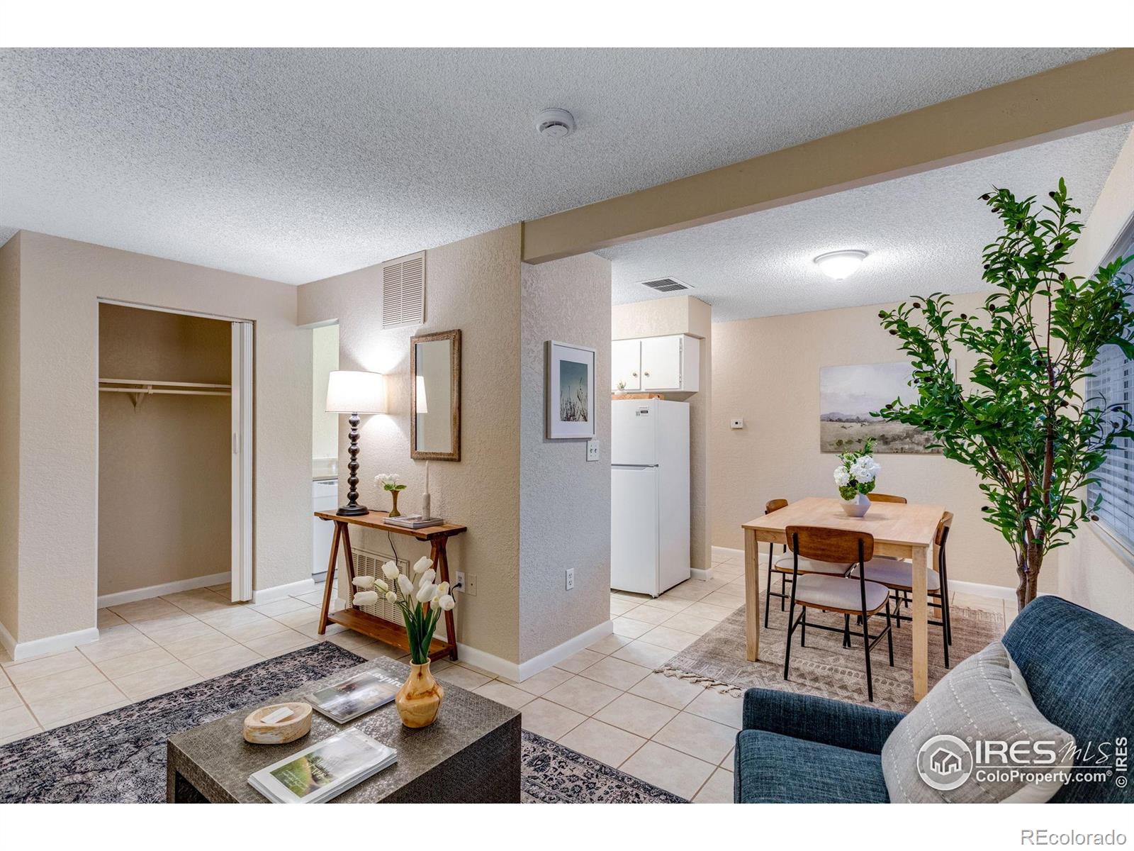 1705 Heatheridge Road Fort Collins, CO 80526 - Photo 9 of 21 a living room with furniture and a potted plant