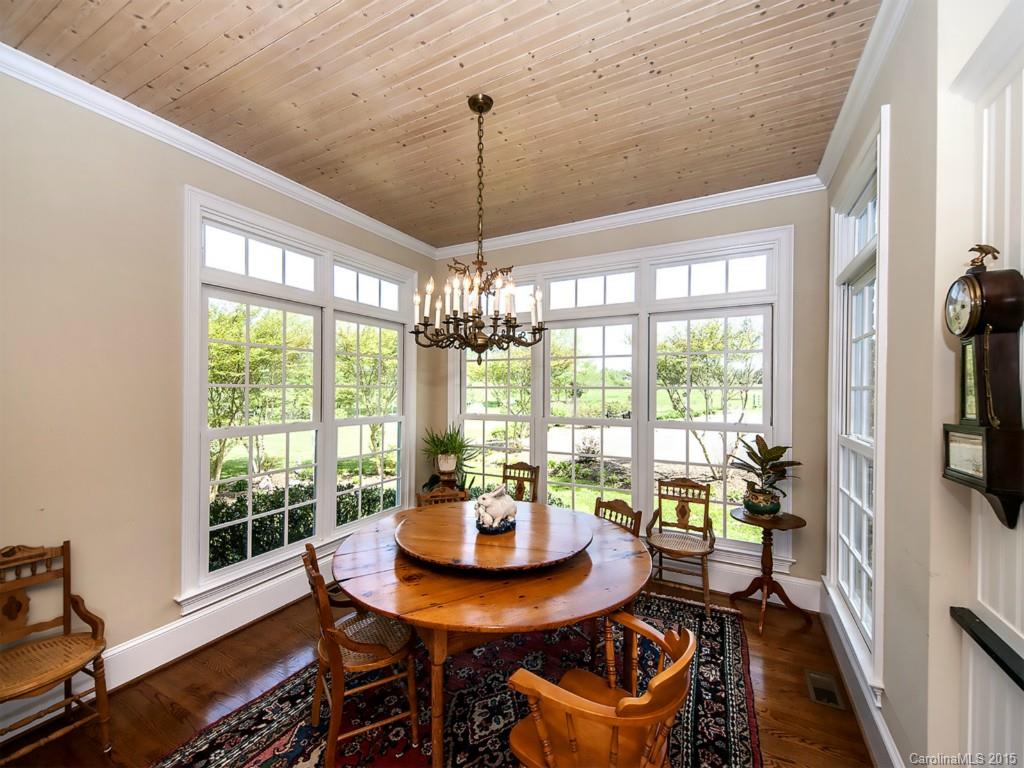 5029 Mobley Store Road McConnells, SC 29726 - Photo 7 of 24 a dining room with furniture a chandelier and wooden floor