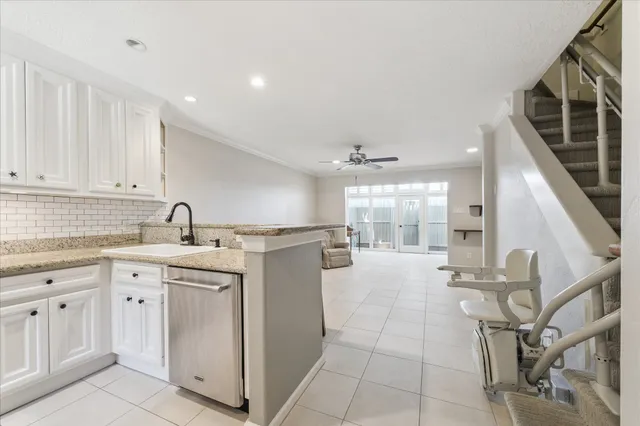 a kitchen with sink cabinets and window