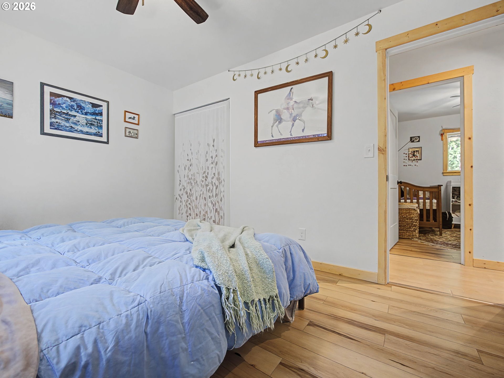 36036 Southeast Gunderson Road Sandy, OR 97055 - Photo 16 of 48 a bedroom with double bed and a wooden floor