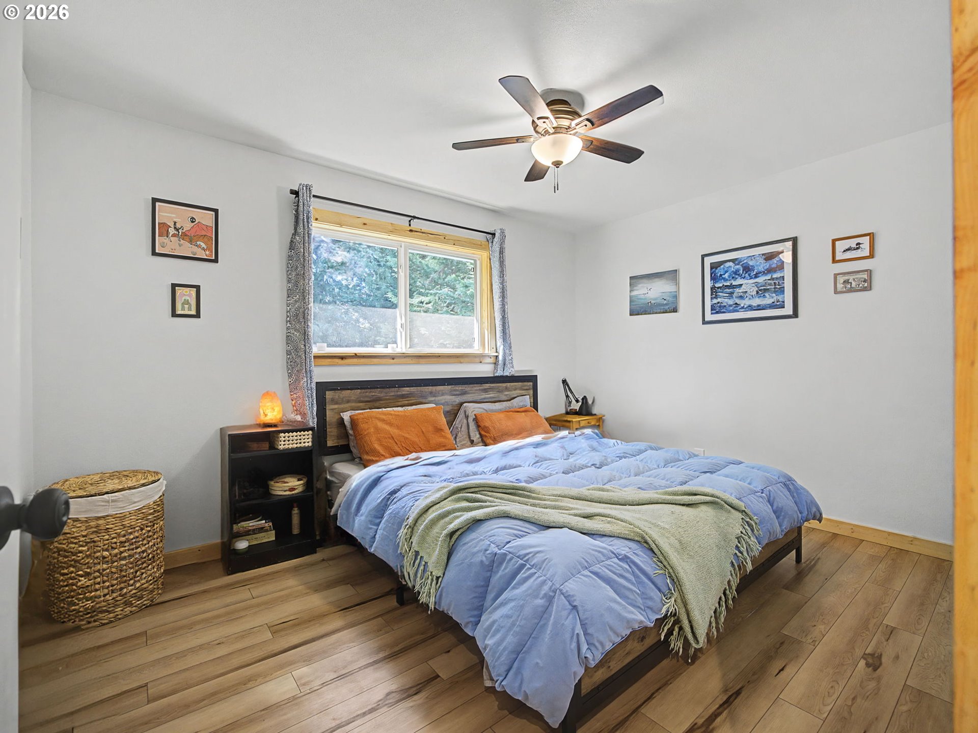 36036 Southeast Gunderson Road Sandy, OR 97055 - Photo 17 of 48 a bedroom with bed and wooden floor