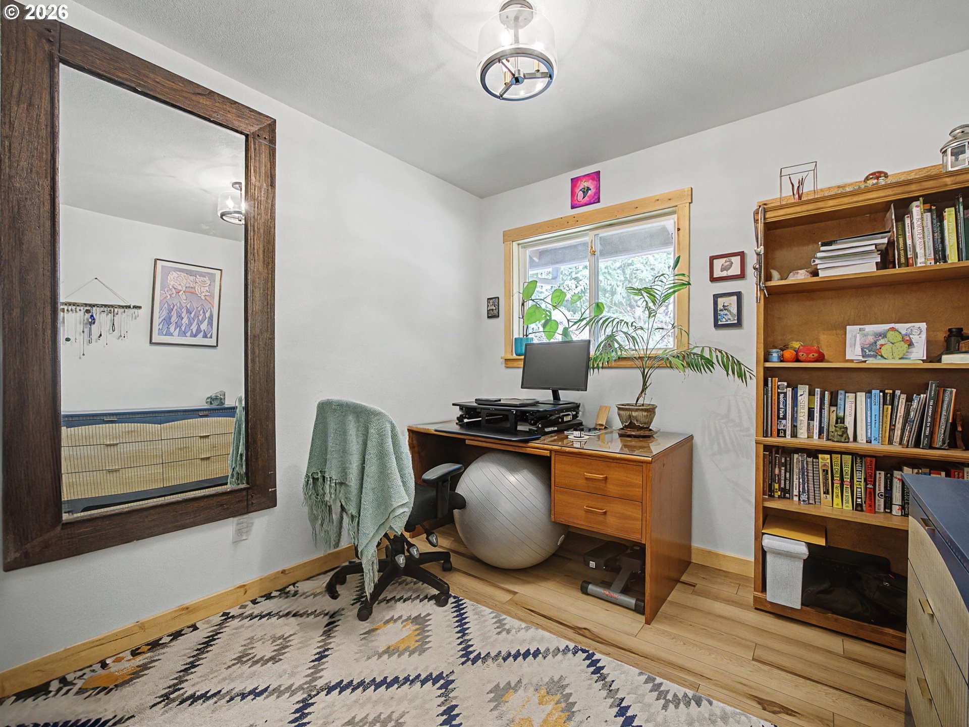 36036 Southeast Gunderson Road Sandy, OR 97055 - Photo 22 of 48 a work room with furniture a bookshelf and a window
