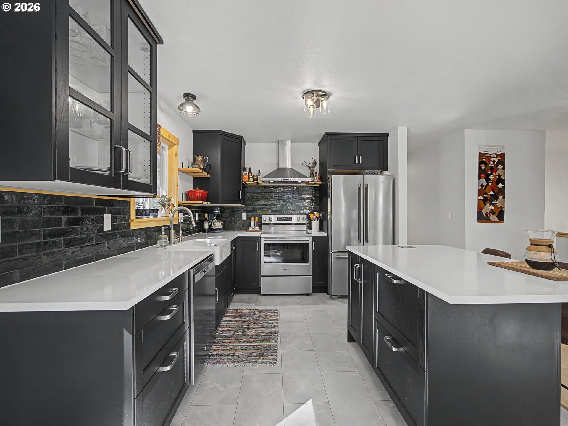 36036 Southeast Gunderson Road Sandy, OR 97055 - Photo 10 of 48 a kitchen with stainless steel appliances a sink stove and cabinets
