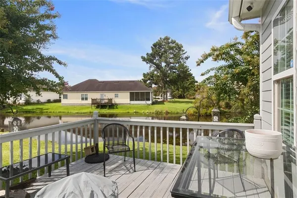a view of a deck with two chair and table