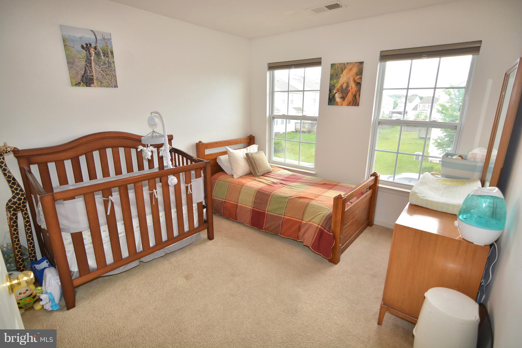 9722 Langley Road Baltimore, MD 21220 - Photo 17 of 30 a bedroom with furniture and a window