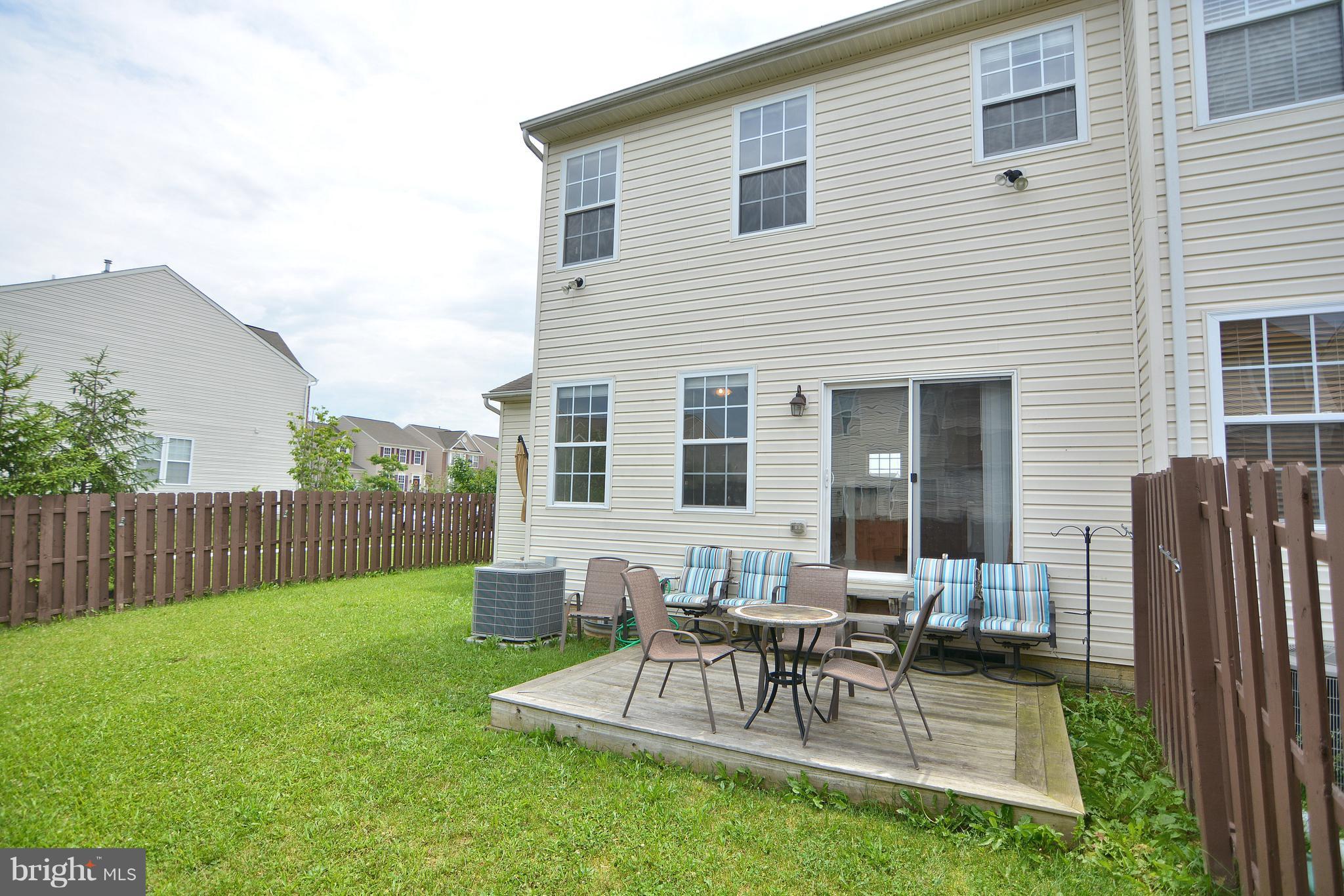 9722 Langley Road Baltimore, MD 21220 - Photo 22 of 30 a view of a house with backyard and a patio