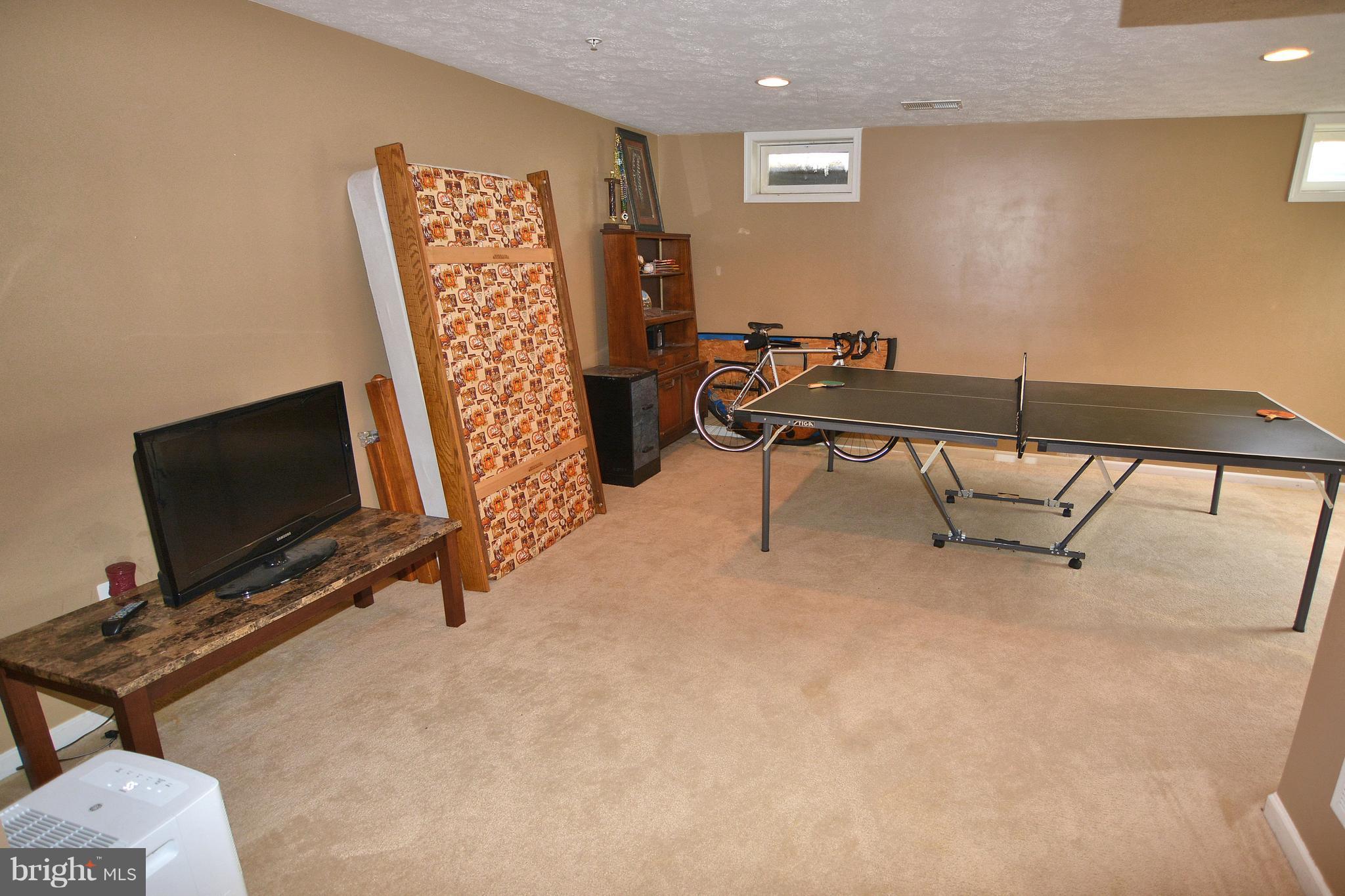 9722 Langley Road Baltimore, MD 21220 - Photo 30 of 30 a view of a livingroom with furniture and a flat screen tv