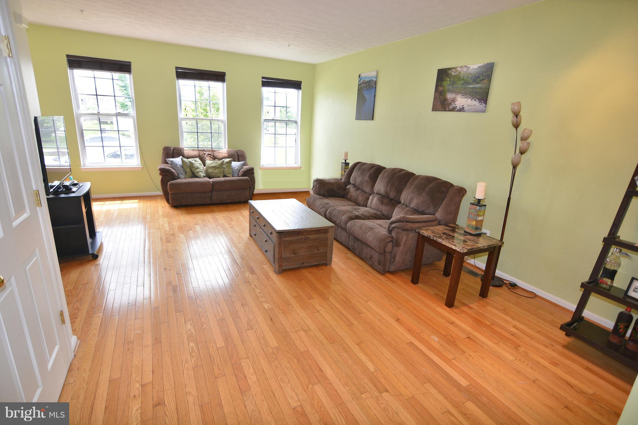 9722 Langley Road Baltimore, MD 21220 - Photo 4 of 30 a living room with furniture and a wooden floor