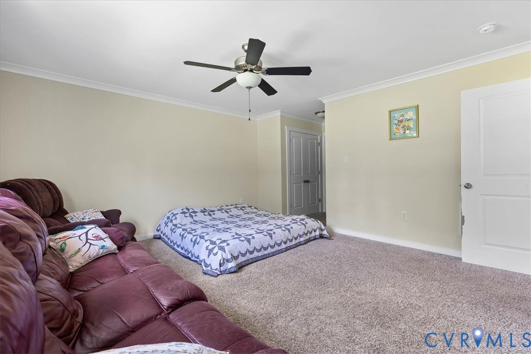 7341 Thweatt Drive Disputanta, VA 23842 - Photo 15 of 38 a bedroom with bed and a window