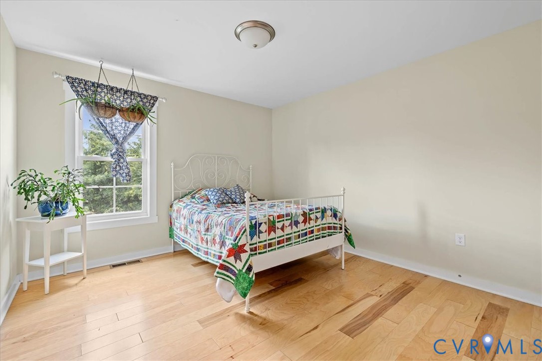 7341 Thweatt Drive Disputanta, VA 23842 - Photo 19 of 38 a bedroom with a bed and a window