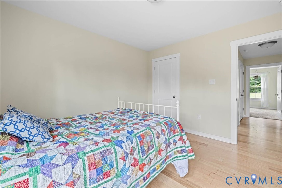 7341 Thweatt Drive Disputanta, VA 23842 - Photo 20 of 38 a bedroom with a bed and a dresser