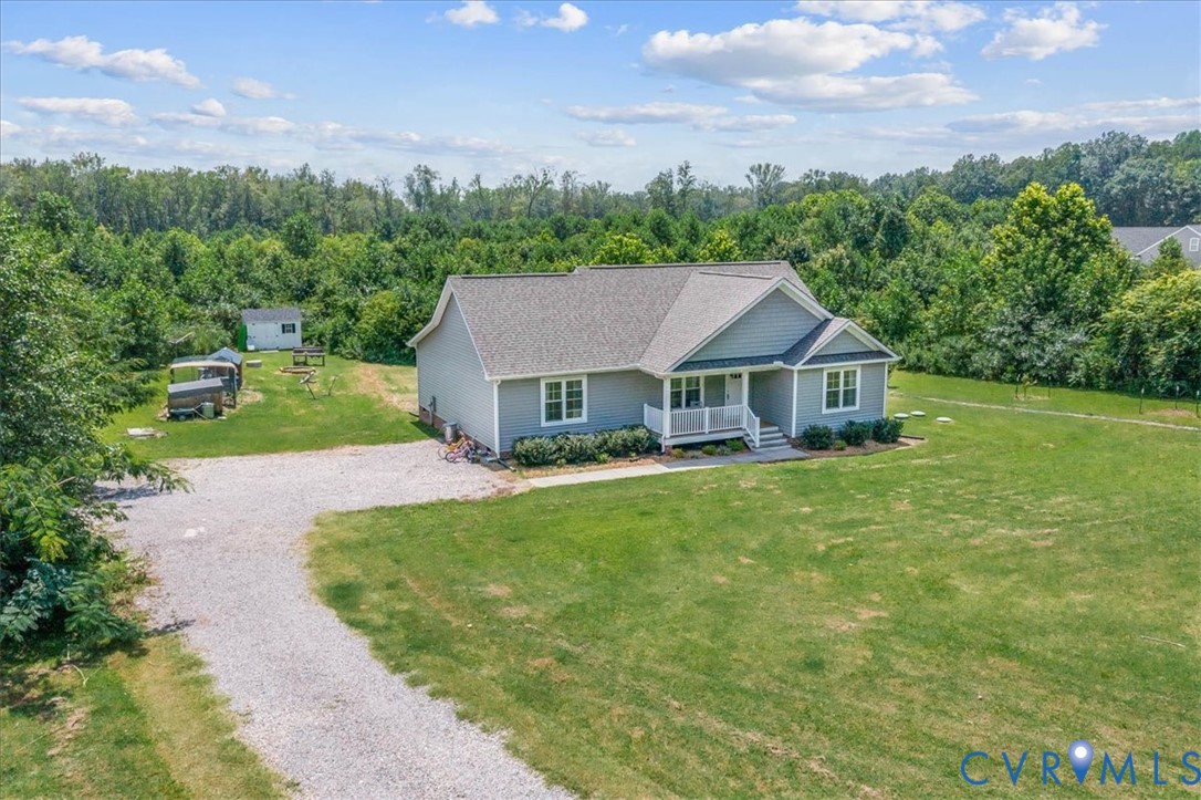 7341 Thweatt Drive Disputanta, VA 23842 - Photo 34 of 38 a aerial view of a house next to a big yard and large trees