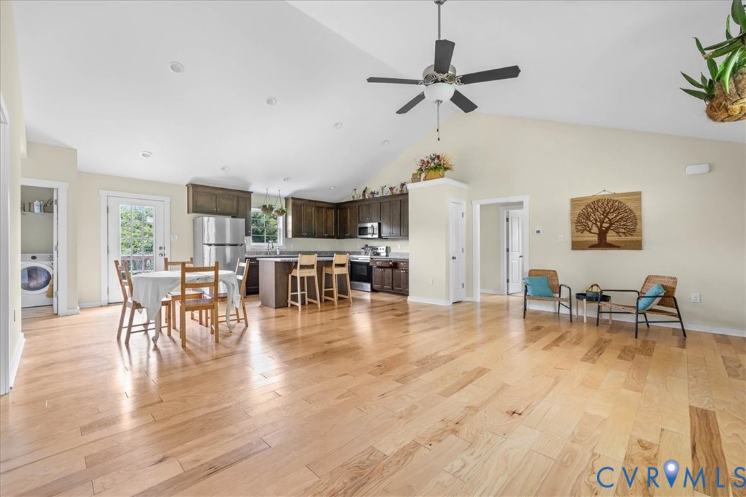 7341 Thweatt Drive Disputanta, VA 23842 - Photo 6 of 38 a view of a dining room with furniture and wooden floor