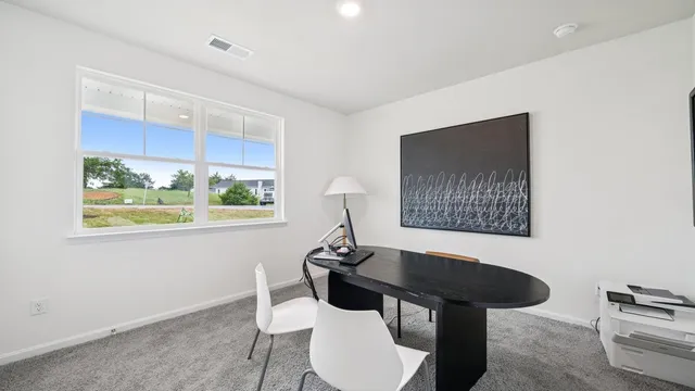 a view of a workspace with furniture